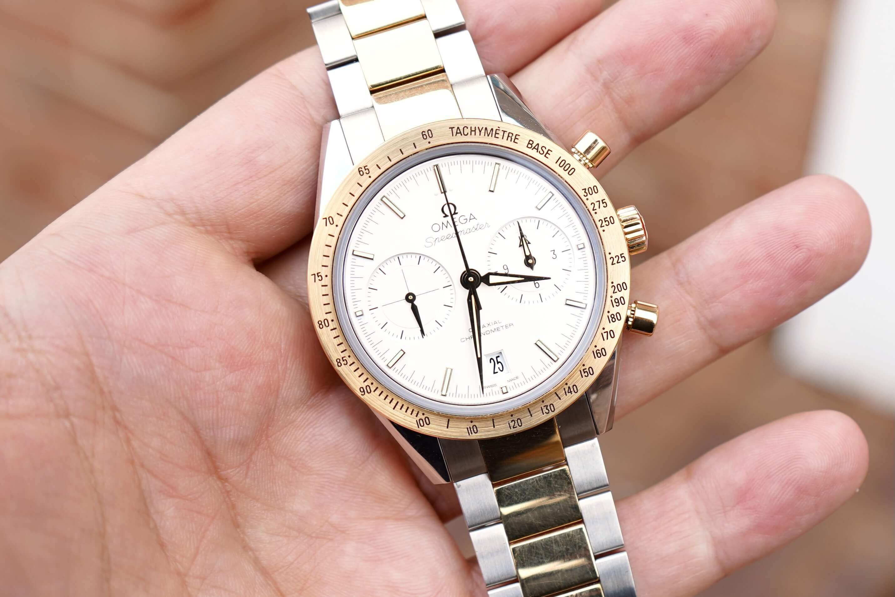 Omega speedmaster cheap 57 gold